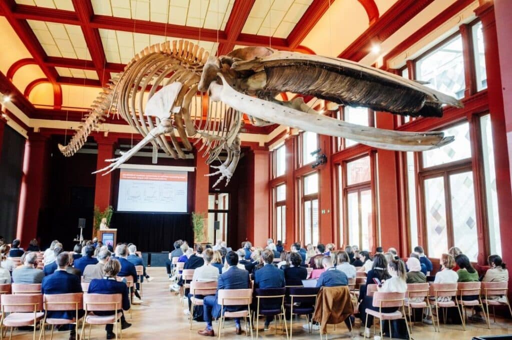 Plenary session at Antwerp ZOO, with the whale skeleton hanging above the audience